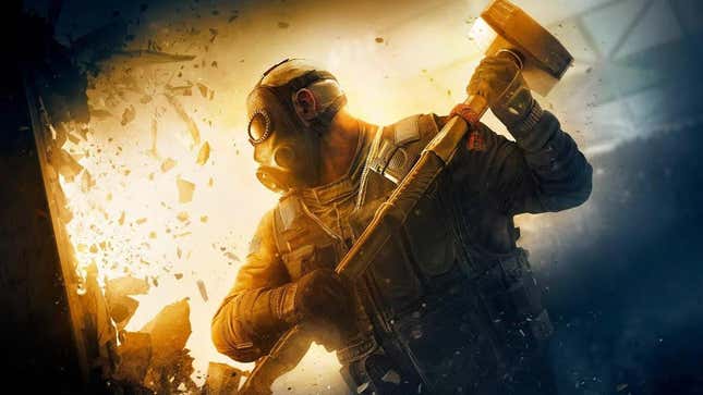 In Rainbow Six Siege, an operator smashes a wall with a hammer. 